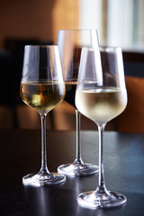 Glasses of wine on table