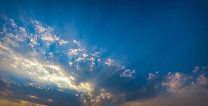 Time Lapse Beautiful scenic sunset with rays of sun shining through clouds