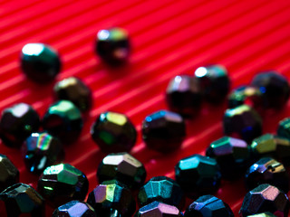 Abstract Colorful beads on red background