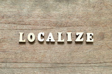 Letter block in word localize on wood background