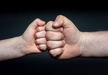 Father and son bond fist bump
