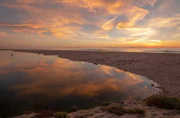 Sunset cloud reflection over Santa Clara river at Ventura beach in California United States