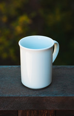 Obraz premium white cup on wooden background