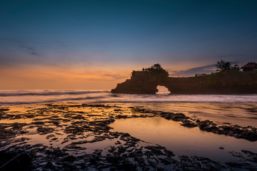 Silhouette Tanah Lot with sun set in evening at Bali, Indonesia.