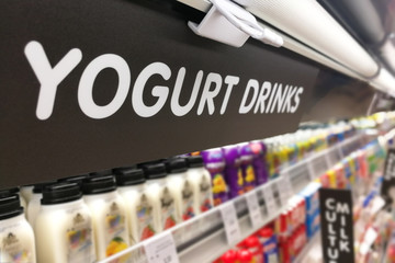 Yogurt signage at the fresh chiller refrigerated section of supermarket