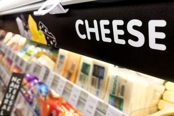 Cheese signage at the fresh chiller refrigerated section of supermarket