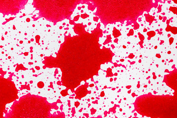 red paint drops on white background