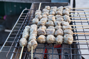Thai fish ball with bamboo stick on the stove. Selective focus