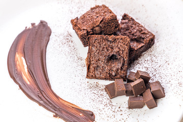 chocolate cake with whipped cream and chocolate brownie