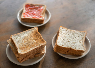 Close up of different sliced ​​bread with jam and toasted