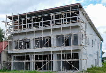 Naklejka premium Town home or town house is under construction, house biulder