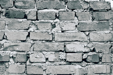The texture of the old brick wall, can be used as a background. Black and white image. Closeup of abstract texture.