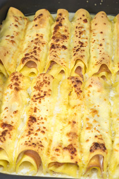 Cannelloni with mushrooms and cooked ham