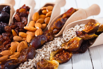 dried super foods on white wood table background