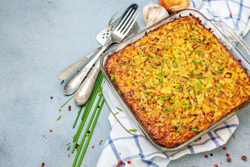 Potato kugel gratin in a glass pan.