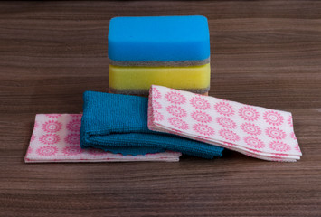 Obraz na płótnie Canvas Three rags and sponges for house cleaning