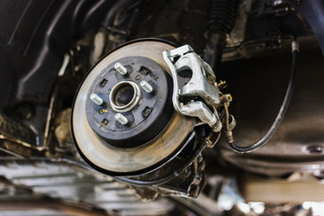 Car brake disc repair on a lift, auto brake system