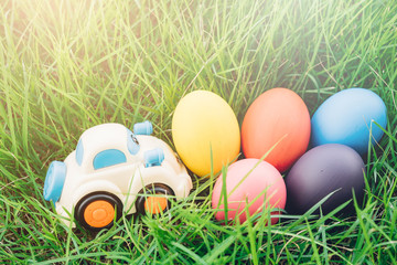 Easter egg and Car on grass background,