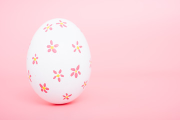 Fototapeta na wymiar Beautiful Easter White egg color on pink