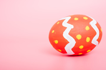 Beautiful Easter Red egg color on pink background, Easter day concept
