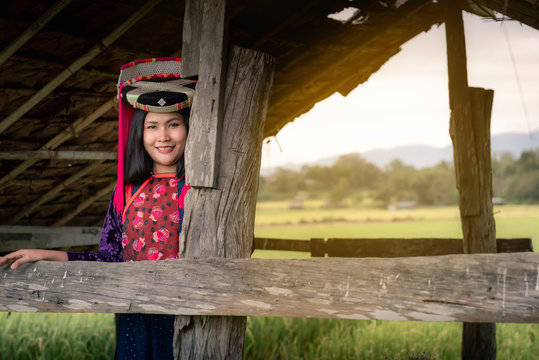 Portrait of woman tribal Lisu in traditional clothing and jewelry costume in cottage., Lifestyle of hill tribe girl in the north of Thailand., Asian ethics cultural