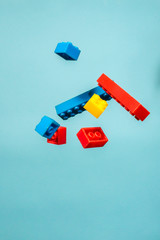 Floating Plastic geometric cubes in the air. Construction toys on geometric shapes falling down in...
