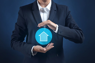 Businesswoman holding something on color background
