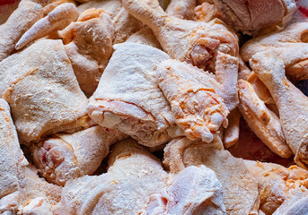 Raw cut parts chicken in flour prepare frying.