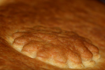 Homemade baked puff pastry with ornament macro shot, golden brown baked puff pastry