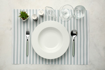 Simple table setting on light background