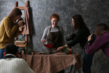 Professional photographers working together in studio