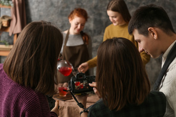 Professional photographers working together in studio
