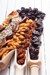 dried super foods on white wood table background