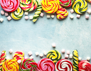 Different sweets on color background