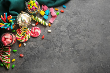 Different sweets on grey background