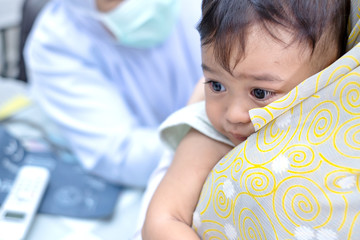Mother huge baby son cry see doctor at hospital.