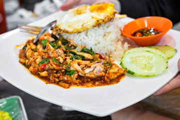 Crab basil fried with rice, fish sauce and vegetable in Thai food menu recipe.
