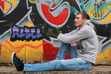 Obraz na płótnie Canvas a young man in a hoodie hip-hop