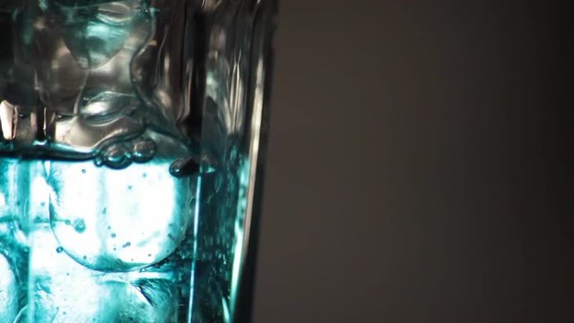 Glass filling up with liqueur