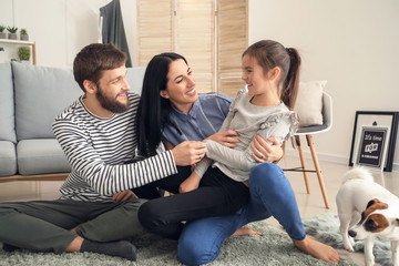 Portrait of happy family at home