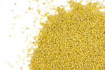 Yellow millet groats isolated on white background