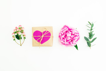 Valentine day composition. Concept with pink peony flower, hypericum and eucalyptus with gift box on white background. Flat lay, top view