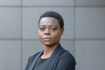 Portrait of black business lady with short hair