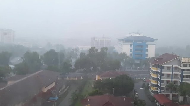 full HD footage - rainy day view through window glass. concept of rain season, mood and nature