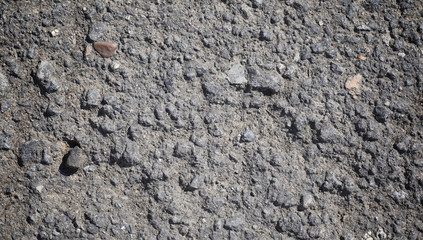 Texture of concrete. Asphalt background. Road surface. Texture of asphalt and stones on the road.