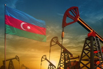 Azerbaijan oil industry concept. Industrial illustration - Azerbaijan flag and oil wells against the blue and yellow sunset sky background - 3D illustration - obrazy, fototapety, plakaty