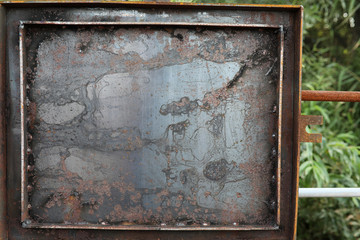 The texture is metallic. Industrial background from an old rusty metal. Textured metal background with rust and cracks.