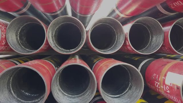 Oil well casing bundles stacked on the deck of a drilling rig