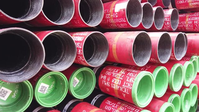 Oil well casing bundles stacked on the deck of a drilling rig