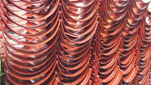 Red casing centralizers stacked on the deck of a drilling rig